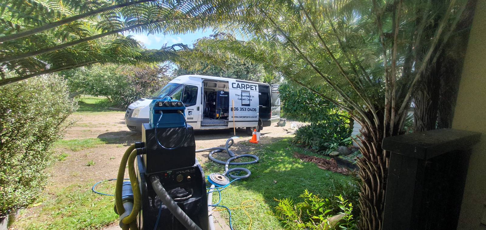 Carpet Pro work van and portable cleaning machine in a Feilding driveway